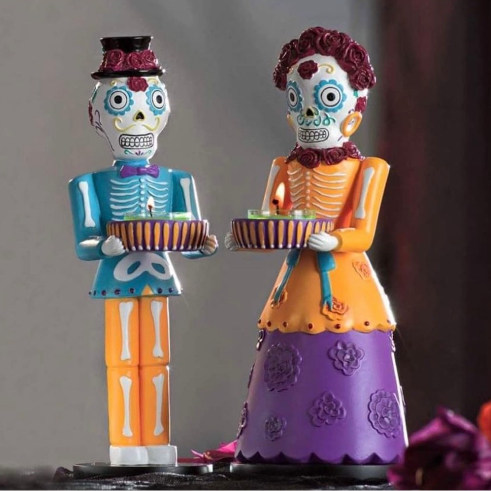 PartyLite Dia de los Muertos tealight holder pair.